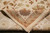 Back of the Indian hand-knotted rug folded over to show even knot rows