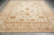 10' x 14'1" Indian rug shown lengthwise with cotton fringe and balanced floral layout