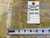 Back tag reading rug number 20398, size 10.9 x 13.3, beside a tape measure