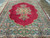 Living room size 9x12 Persian rug shown flat with wide green and blue floral borders