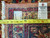 Back of the rug with tape measure, showing tight hand-knotted wool weave and original inventory tag