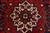 Close-up of the ivory 8 point star medallion with navy, gold and red geometric leaves