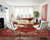 Bright white living room styled with a red geometric Persian area rug and mid-century chairs