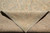 Folded corner revealing cotton foundation and even hand-knotted back of natural wool Peshawar rug