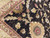 Corner detail of multi-band gold border with crimson outlines meeting the black floral field