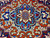 Macro of the medallion core in cobalt blue, orange, ivory and olive green wool