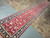 Angled view of the narrow 31 inch wide runner emphasizing its straight edges and length