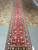 End view of the hallway runner from the fringe with inventory tag attached at corner