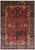 Overhead view of 10 x 14 Jaipur rug with deep red field and navy floral border