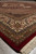 Perspective shot along the border showing lustrous pile, red selvage and thick ivory fringe