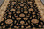 Close overhead of the black field with beige, sage and brown floral heads and vines