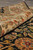 Rolled edge detail showing ivory border, cotton fringe and plush natural wool pile depth