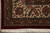 Corner close-up with burgundy outer edge, cream fringe and acanthus leaf border drawing