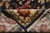 Folded corner revealing hand-knotted back, cotton foundation and ivory fringe of this Indian wool rug