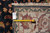 Back tag and tape measure confirming size on this hand-knotted Oriental rug from India