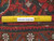 6x9 wool Heriz rug shown with a ruler across the pile confirming authentic handmade knotting