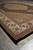 Low corner angle highlighting dense lustrous pile, rust guard stripes and black outer border edge
