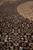 Macro shot of the Herati fish motif field showing tiny knots and silk highlights