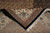 Folded corner revealing the tight back weave, cotton foundation and hand-knotted construction of this rug