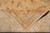 Back of the hand-knotted rug folded over the pile showing even weave and cotton fringe