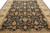 8'10 x 12'1 Indian Zigler rug seen from the end with rust vines and ivory border