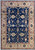 Full overhead view of navy blue Soltanabad rug with camel border and rust floral rosettes
