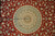 Close-up of the peach and blue star medallion with concentric cartouche rings and center rosette