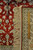 Ruler placed on the rug back showing fine knots per square inch of this 6x9