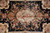 Close-up of the ivory cartouche medallion with pink roses on a deep black field
