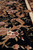 Bamboo silk pile detail showing sheen, pink blossoms and caramel acanthus scrolls on black