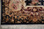 6' x 9' area rug corner detail with burgundy border, ivory scrollwork and cotton fringe