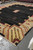 Oversize 12x15 Persian Gabbeh rug laid out in the Rugs.net warehouse showing its full border