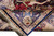 Folded corner revealing rug back, silk fringe and navy border medallion with lions and elephants