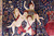 Three cherubs with tambourine and flower basket woven in blush silk on navy ground