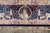 Border roundel portrait of a woman with instrument, flanked by cherubs riding grazing animals