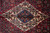 Close-up of the ivory and blue diamond medallion with red palmettes and green floral accents