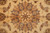 Close-up of the central star medallion in soft gray, apricot and ivory with silk highlights