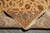 Folded back corner showing tight cotton foundation, fine knotting and flat-woven ends with fringe