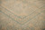 Shallow depth detail of mitered corner joining inner key fret and scrolling star border