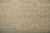 9x8 Peshawar rug detail showing rosette panels, key fret squares and zigzag guard stripe
