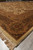 Perspective view along the long side showing fringe, corner border medallion and thick wool pile