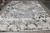 10 x 14 Indian modern rug viewed overhead with charcoal zigzags on ivory ground