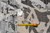 Back tag and tape measure confirming size on genuine hand-woven Oriental rug reverse