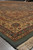 Angled corner view of 9x12 Oriental rug showing layered guard borders and green edge