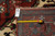 Back tag marked F-4582 with tape measure confirming the 9.9 x 13.9 rug size