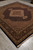 Full rug on stone floor showing balanced medallion layout suitable for living room or dining room