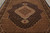 Ivory diamond medallion and dense Herati lattice filling the center of this Oriental rug