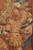 Detail of gilded parade armor, plumed helmet and engraved shield woven in rust and gold
