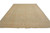 Angled display of neutral green and gold hand-knotted wool rug showing soft faded floral border