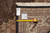 Back tag and tape measure confirming the 7'11" x 10'2" size on this hand woven rug